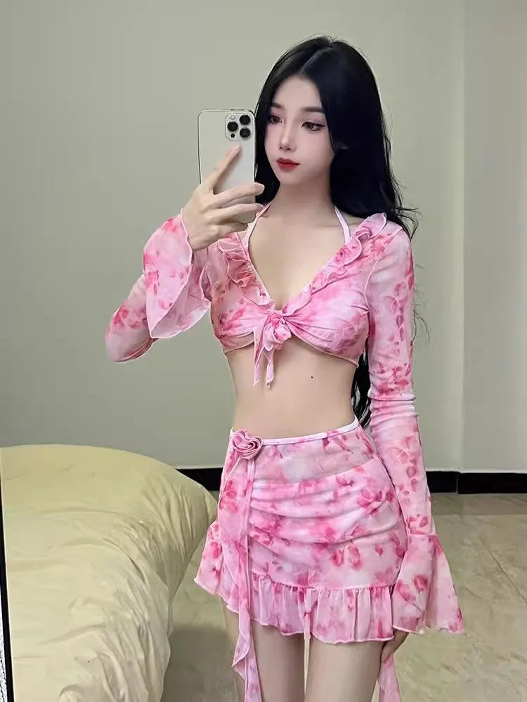 Women's cherry blossom pink floral bikini swimsuit set on a white background.