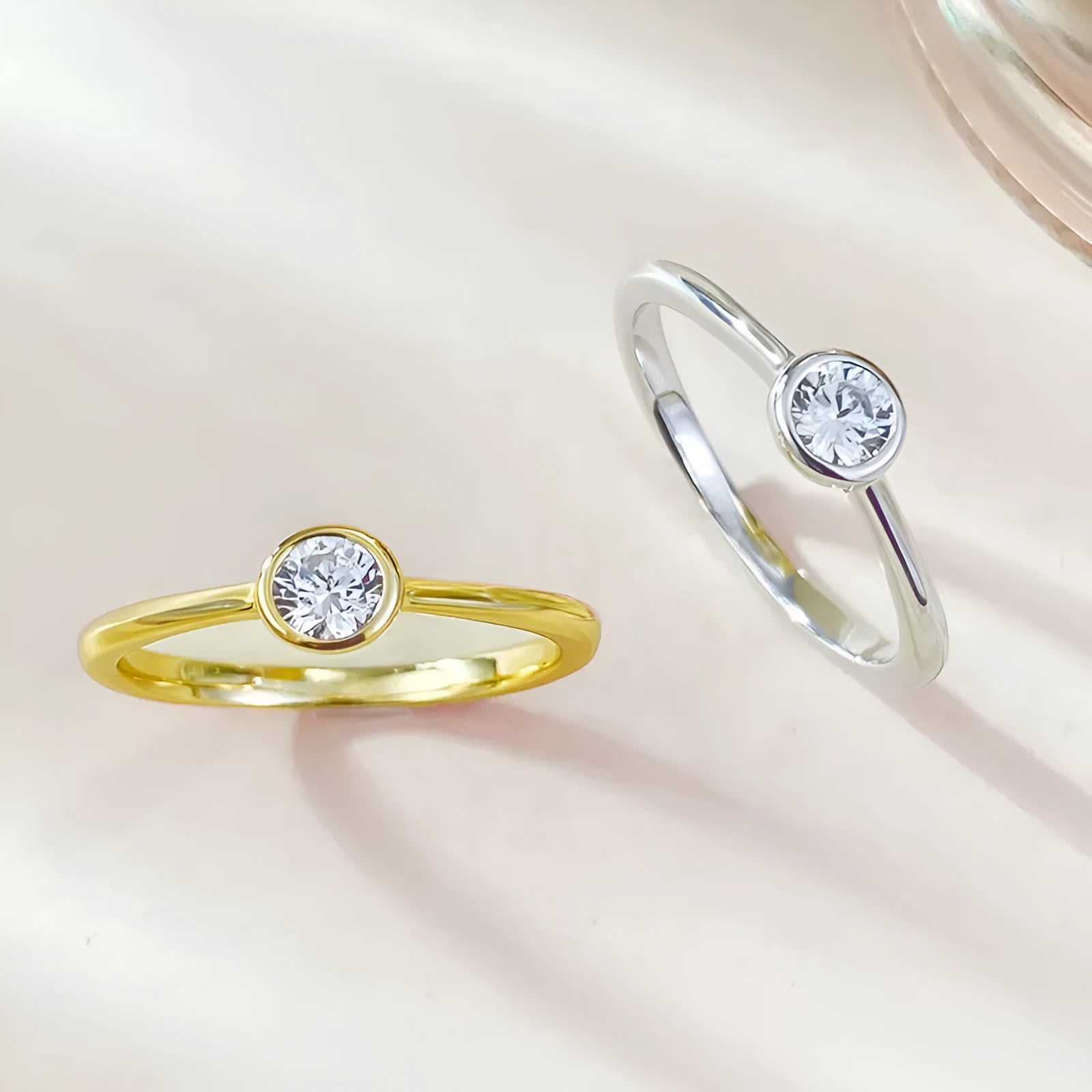 Minimalist crown-shaped silver ring with linear details, shown in gold and platinum electroplated finishes.