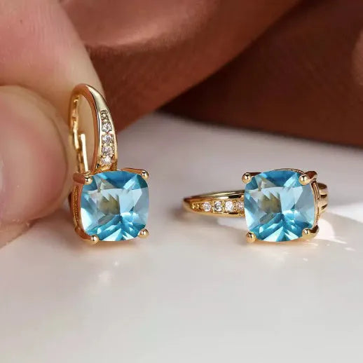Geometric copper ear clip with colourful moissanite stones in quadrilateral pattern