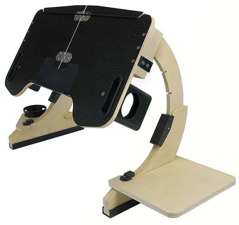Wooden folding computer table on bed showing adjustable angle mechanism in white maple finish