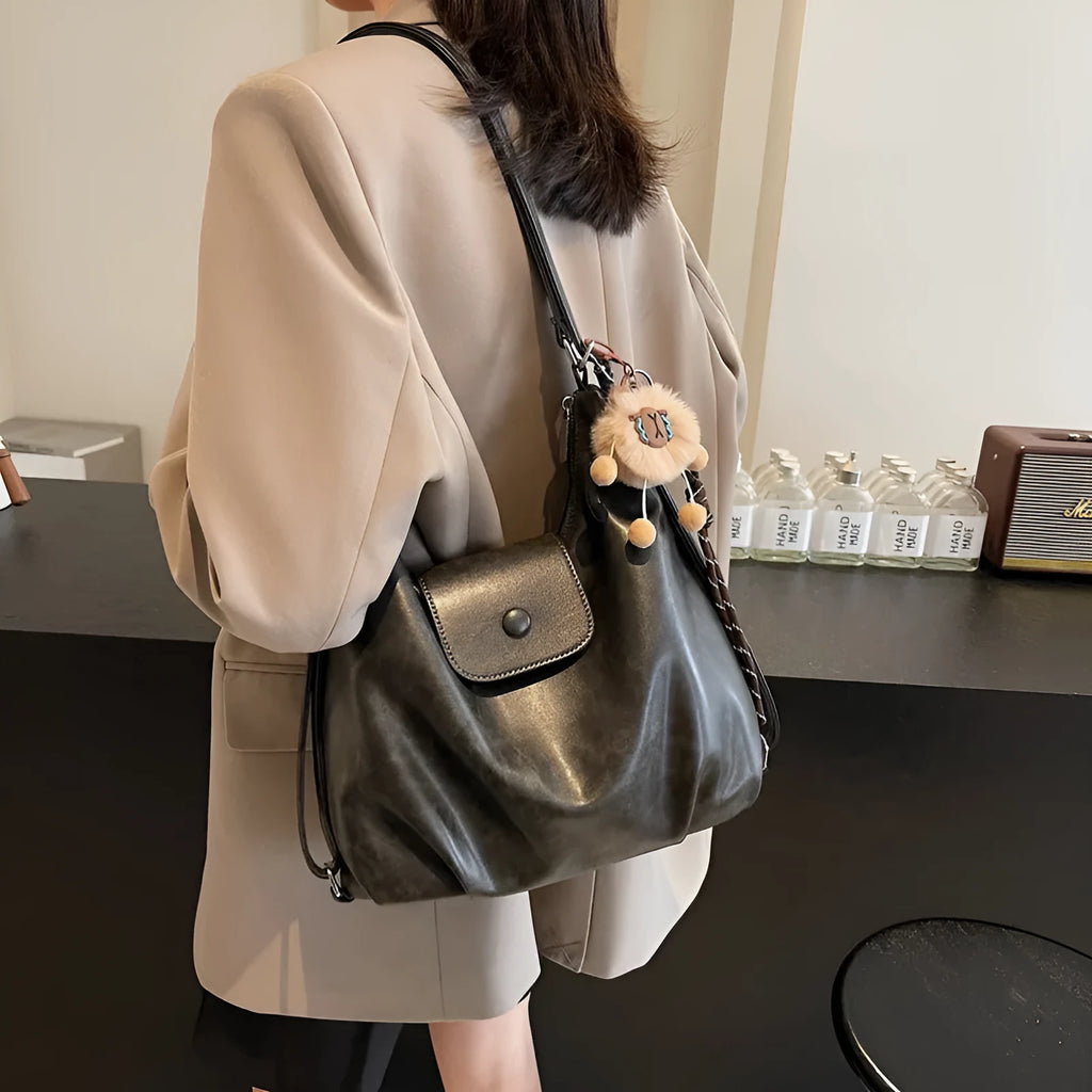 Women's PU leather commuter shoulder bag in horizontal square shape with single strap and optional pendant