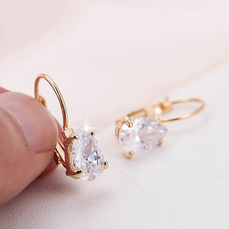 Women's metal drop earrings with gemstone accents in gold or platinum plating options
