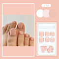 Pack of finished skin colour false toenails and a tube of adhesive glue for nail art.