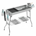 Large stainless steel flip-over barbecue oven with iron grills and charcoal trays for outdoor cooking