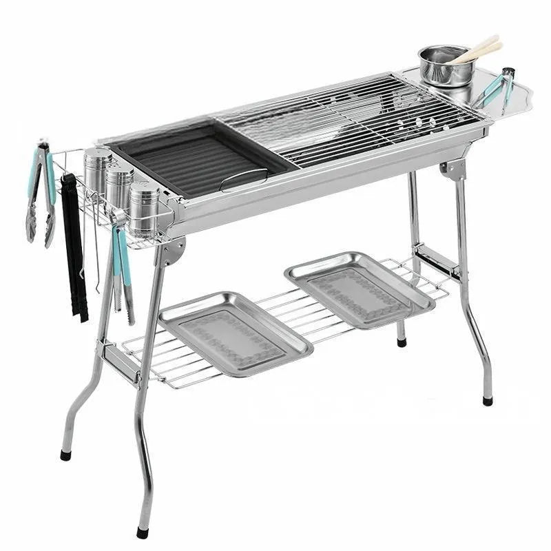 Large stainless steel flip-over barbecue oven with iron grills and charcoal trays for outdoor cooking