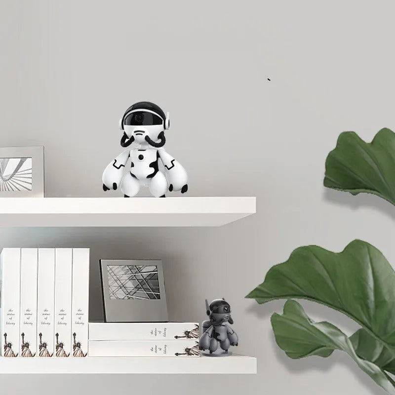 White or black Space Robot 1080P HD battery-powered indoor security camera on its detachable base.