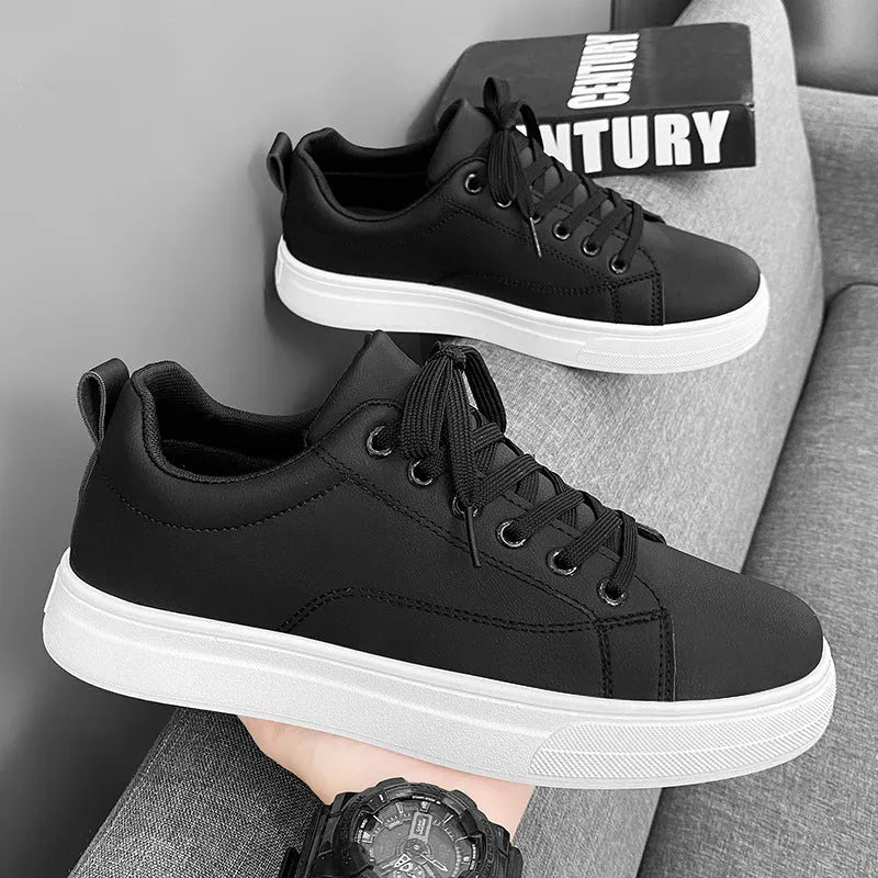 Men's Korean-style low-top sneakers in all black colour with round toe and rubber sole