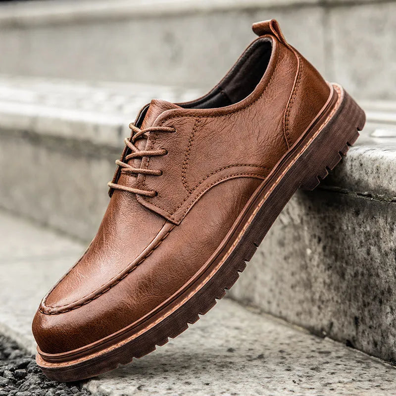 Casual leather shoes in black with round toe, low top design, and visible sewing line detailing