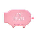 Blue LED alarm clock with USB charging port and temperature display on bedside table