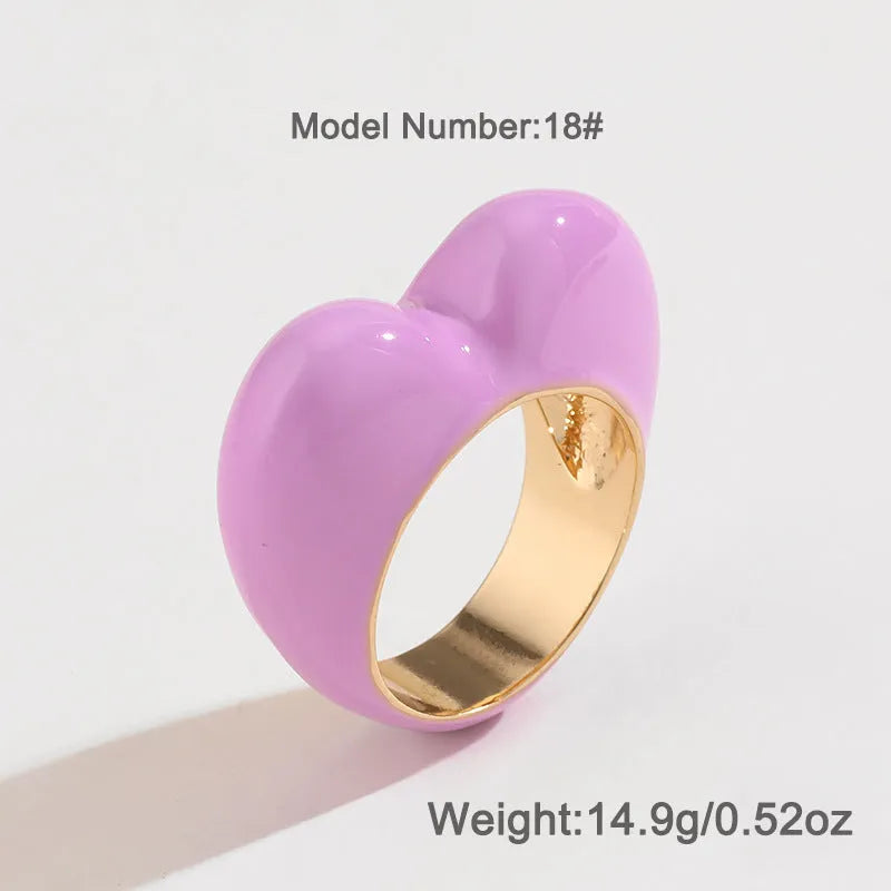 A heart-shaped three-dimensional enamel ring in zinc alloy, shown in one of four available colours.