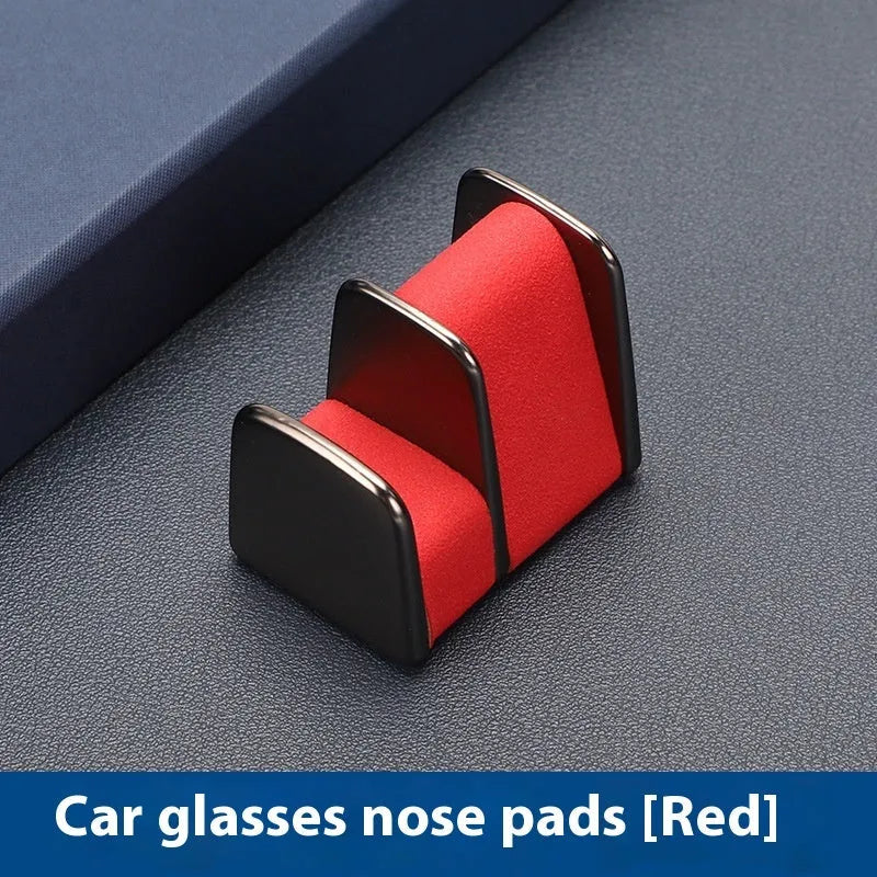 Zinc alloy and leather sunglasses clip for car dashboard storage in four colour options.