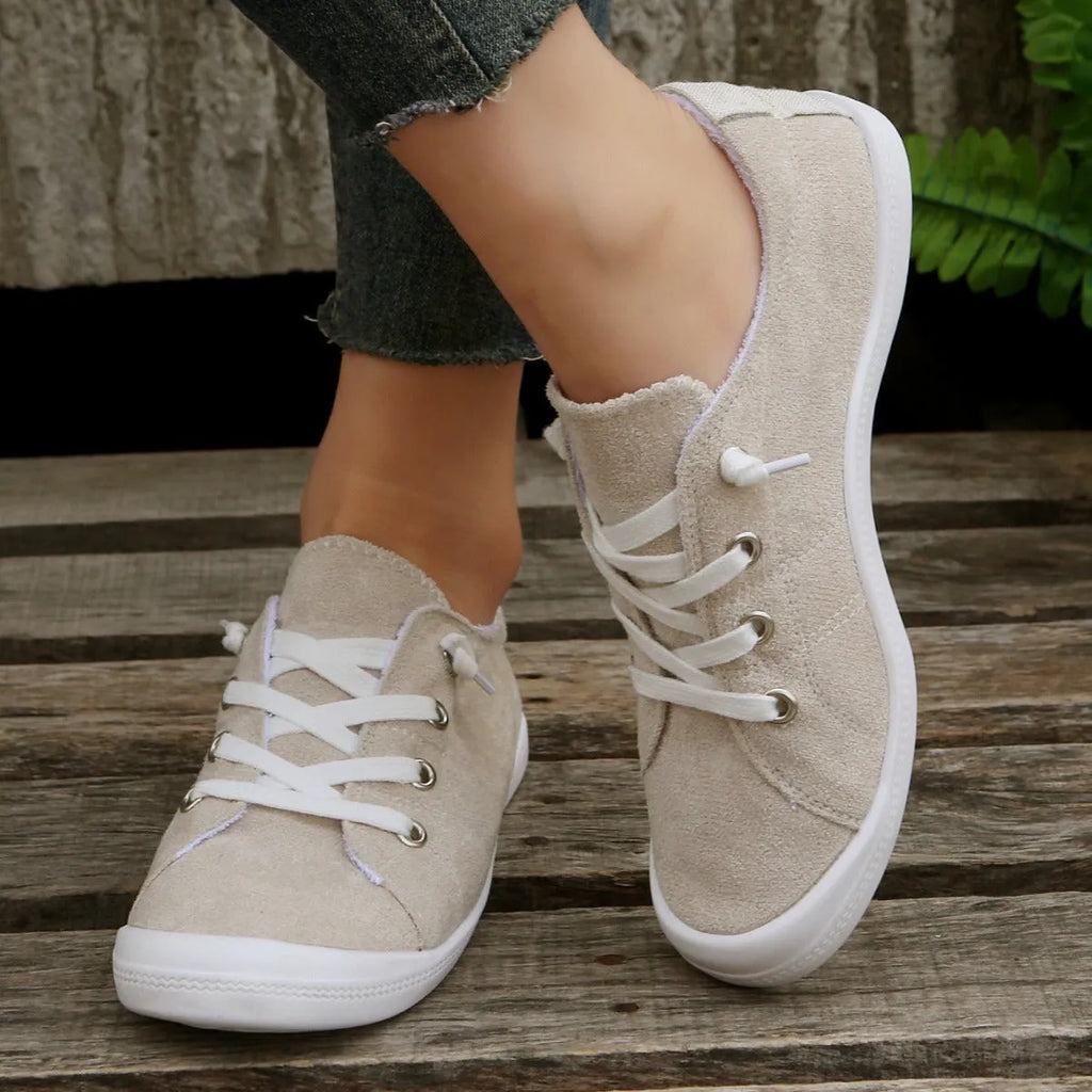 Women's creamy-white fabric low-top casual sneaker with rubber sole