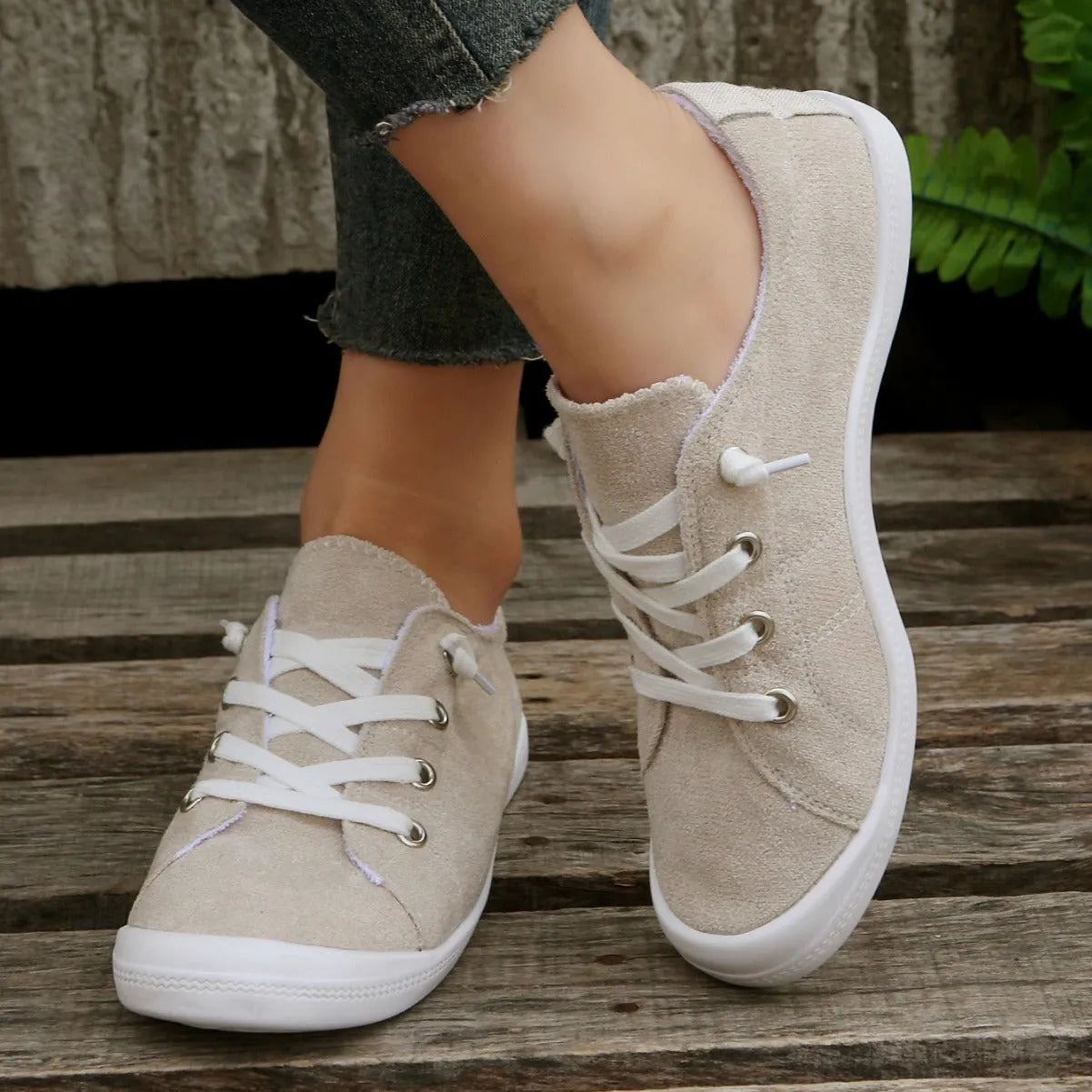 Women's creamy-white fabric low-top casual sneaker with rubber sole