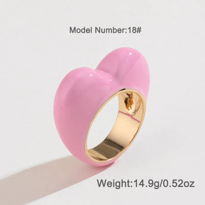 A heart-shaped three-dimensional enamel ring in zinc alloy, shown in one of four available colours.