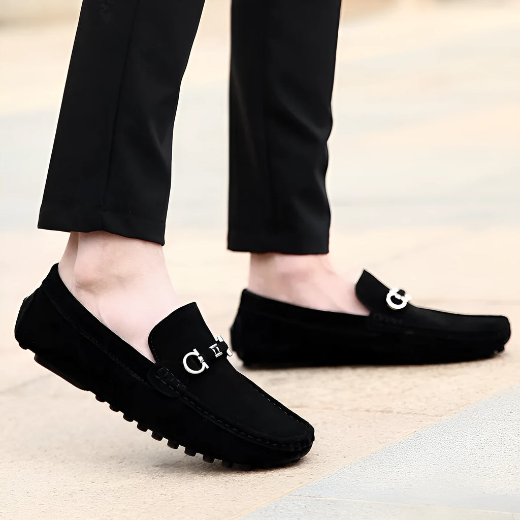 Men's black slip-on cowhide leather shoes with a square toe and flat heel on a white background