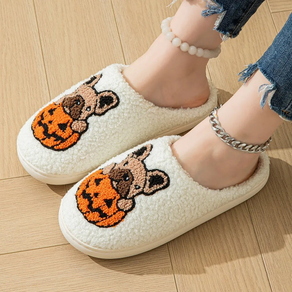 Black and white Halloween slippers with pumpkin patterns and plush fabric construction