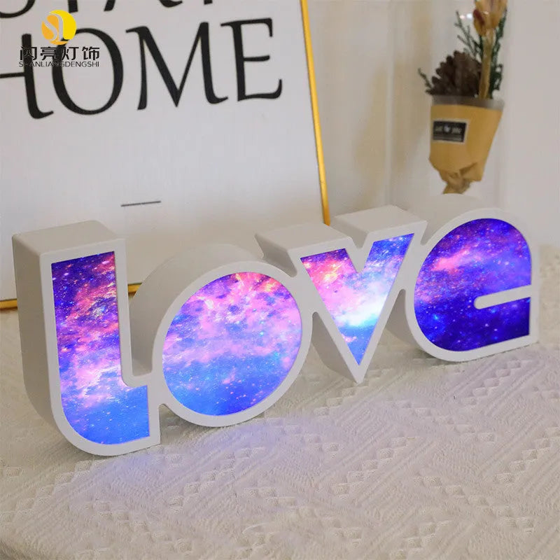 Rainbow coloured LED decorative light spelling LOVE, with USB cable.