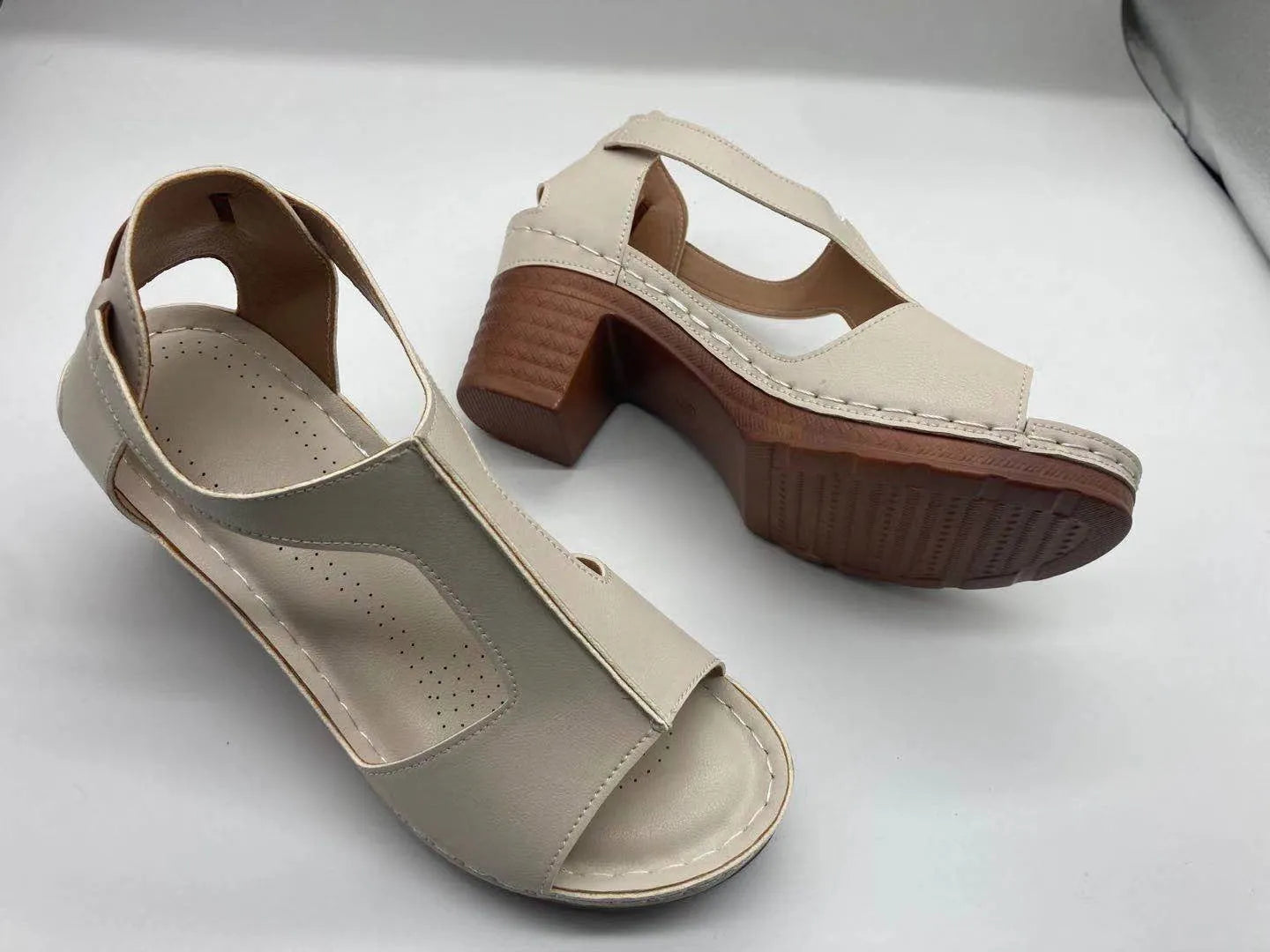 Plus size women's wedge sandals with peep toe, Roman buckle detail, and fish mouth design