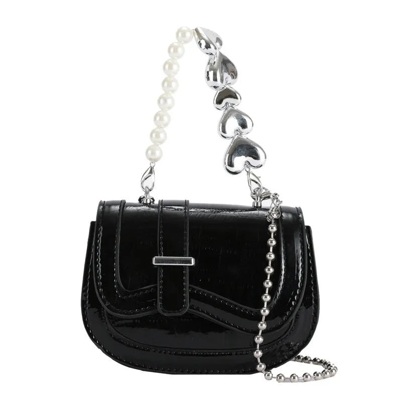 Horizontal square mini saddle bag in PU leather with sandwich pocket detail and adjustable shoulder strap