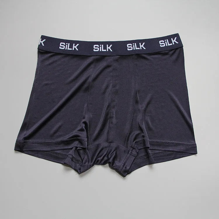 Men's loose fit silk shorts in navy blue colour showing mid waist design