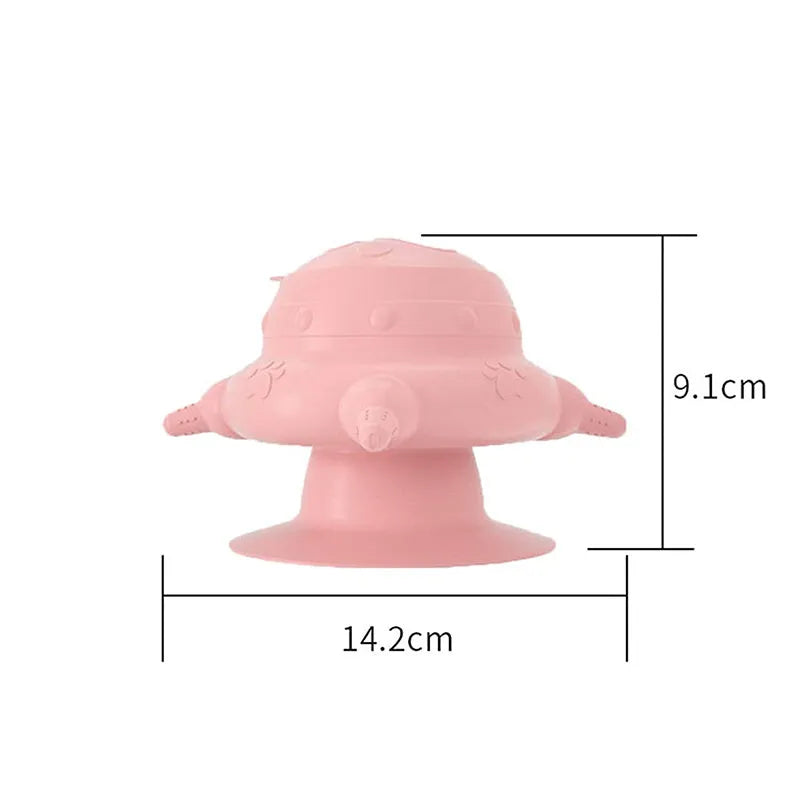 Pink silicone pet nursing device with milk bowl and four pacifiers for puppies and kittens.