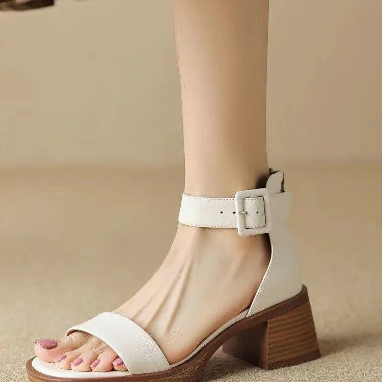 White women's retro platform high heels with an ankle strap and round toe.