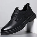 Men's black and brown leather casual sneakers with rubber soles and sewn detailing