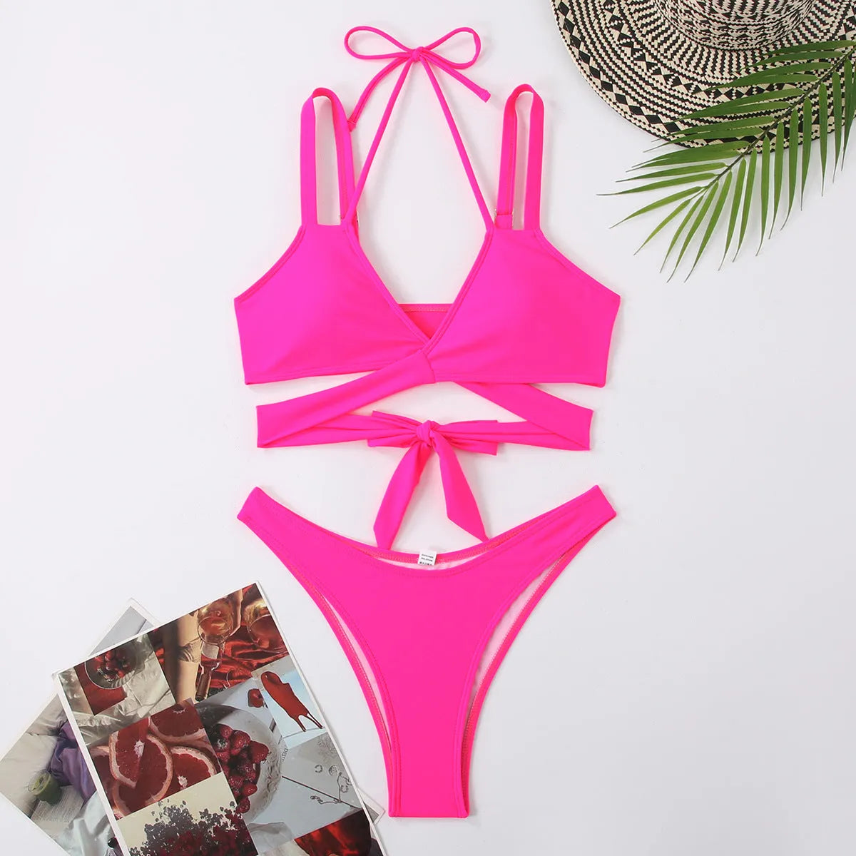 Women's solid colour strappy bikini swimsuit on a hanger, shown in briefs style.