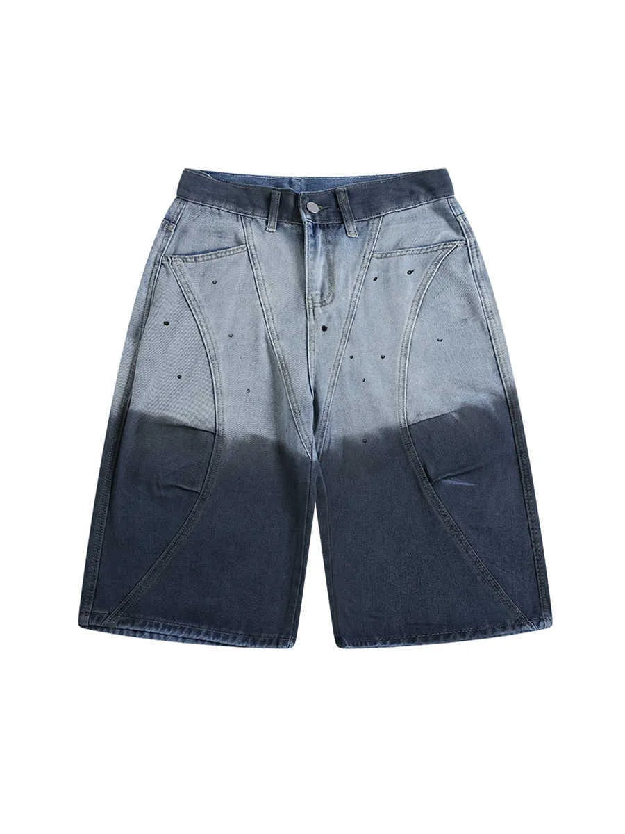 Blue tie-dye gradient cropped jeans with a worn-looking finish and loose, relaxed fit.