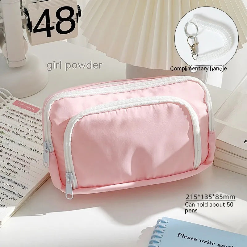 Double layer pencil case with carry handle in blue, cream, green, and pink colour options