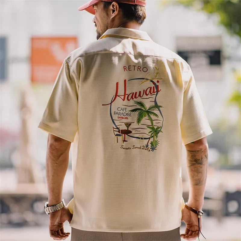 Light apricot men's Cuban collar shirt with a bamboo leaf and flower print