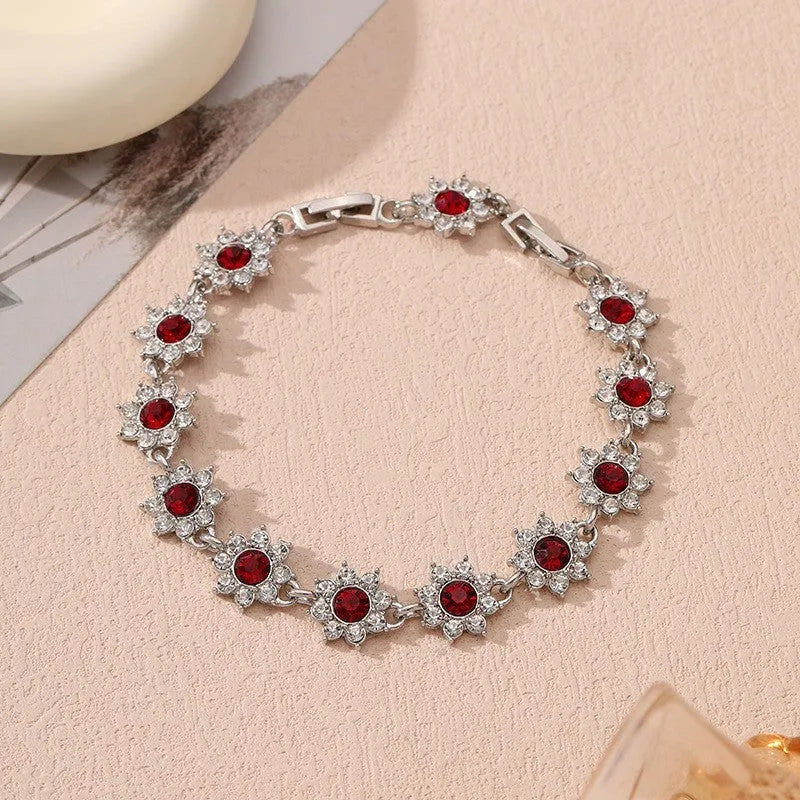 Electroplated zinc alloy bracelet with floral design in gold and silver colour variations