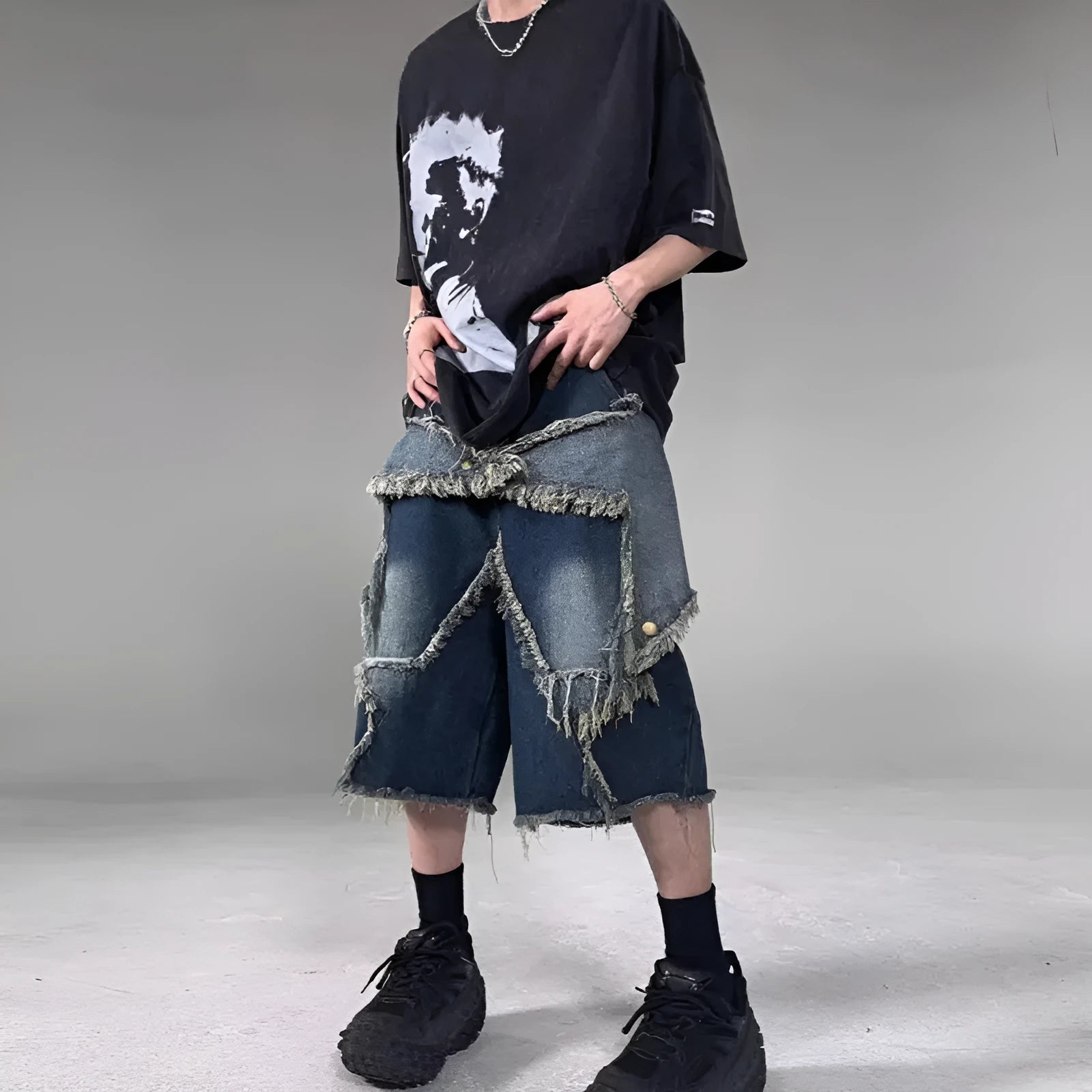 Blue men's loose fit denim shorts with frayed hem and embroidered five-pointed star retro design