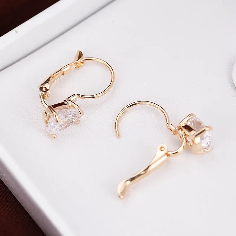 Women's metal drop earrings with gemstone accents in gold or platinum plating options