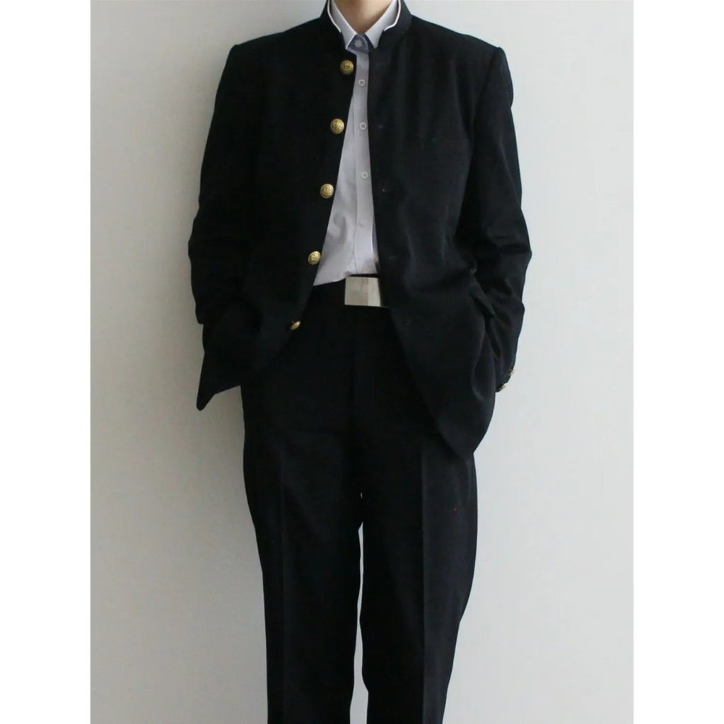 Solid black Korean style casual suit blazer with long sleeves, loose fit, and patch pockets on model