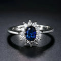 Women's copper floral ring with inlaid zirconium detail in green, blue, or red.