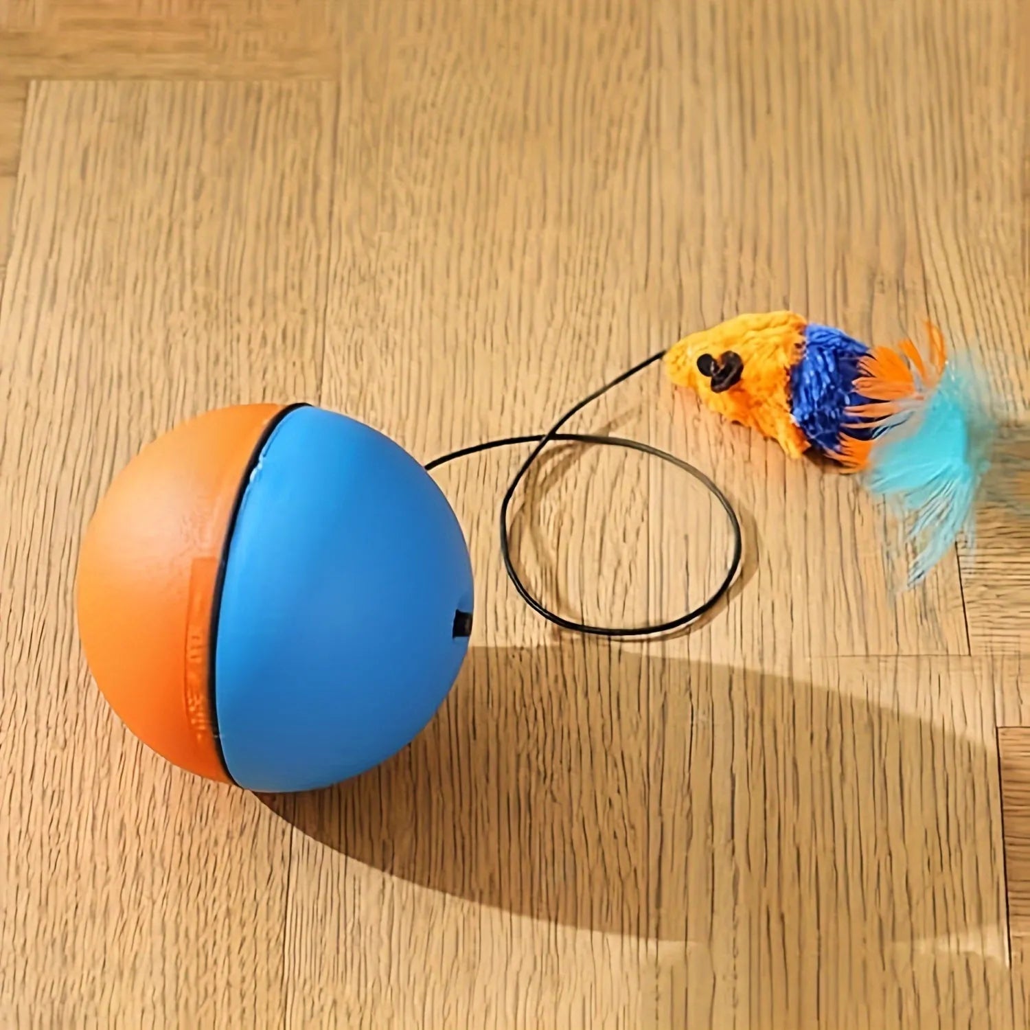 Blue and orange interactive cat toy ball with plush mouse attachment measuring 8.5cm cube