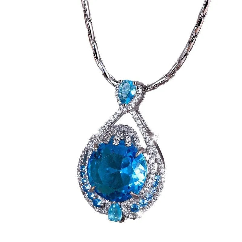 Women's geometric pendant necklace with blue crystal gemstone and water wave chain design