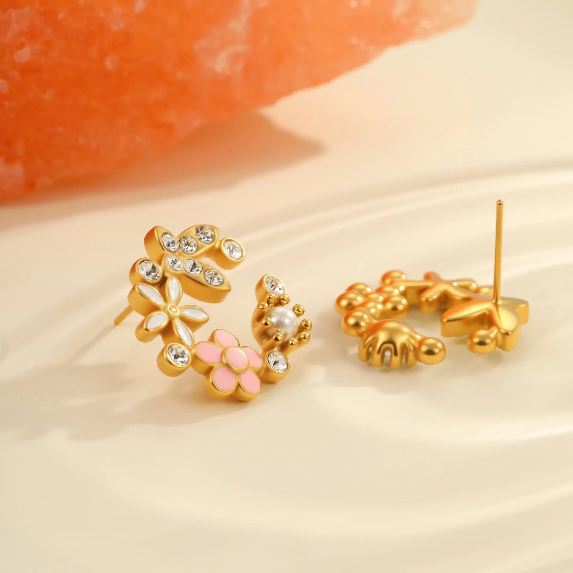 Women's floral stud earrings with petal design in electroplated finish on stainless steel