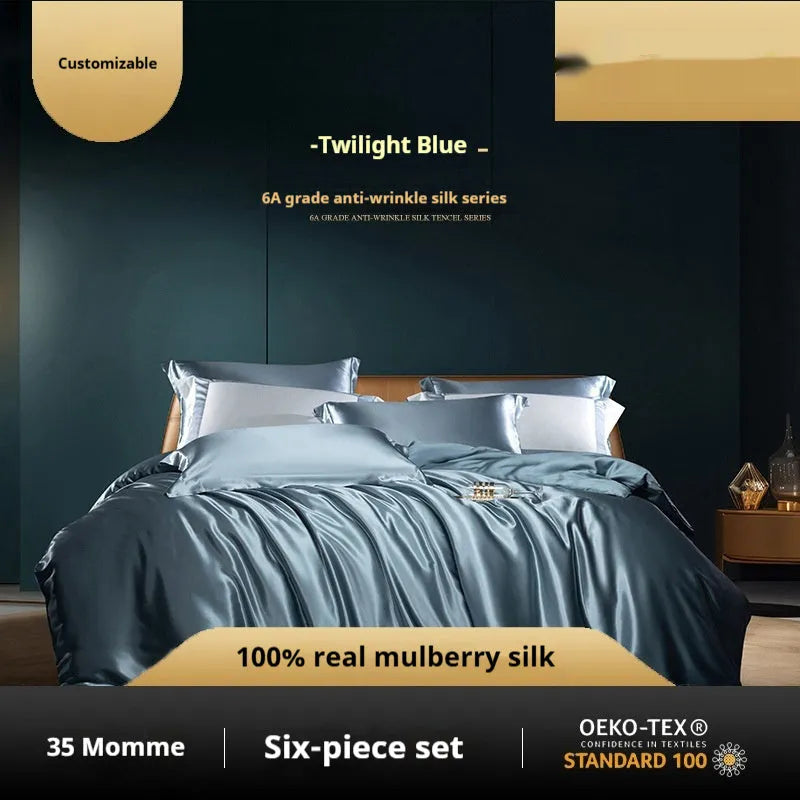 Silk four-piece quilt cover set in a solid colour, shown in a bedroom setting on a bed.