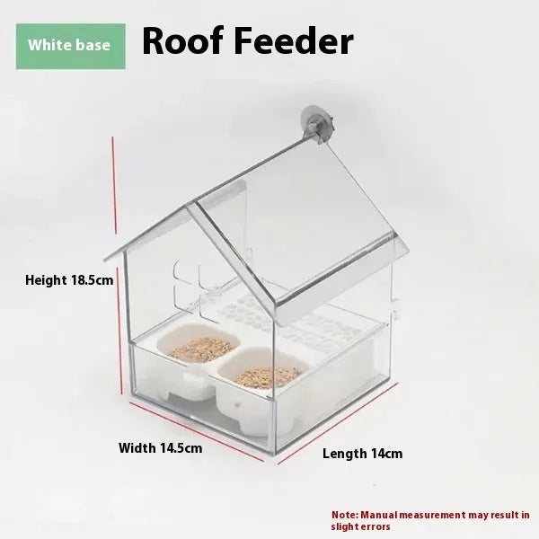 Transparent plastic roof feeder for birds with green and white colour options on outdoor surface