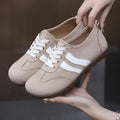 Women's vintage-style canvas sneakers with round toe and flat rubber sole in dark red colour