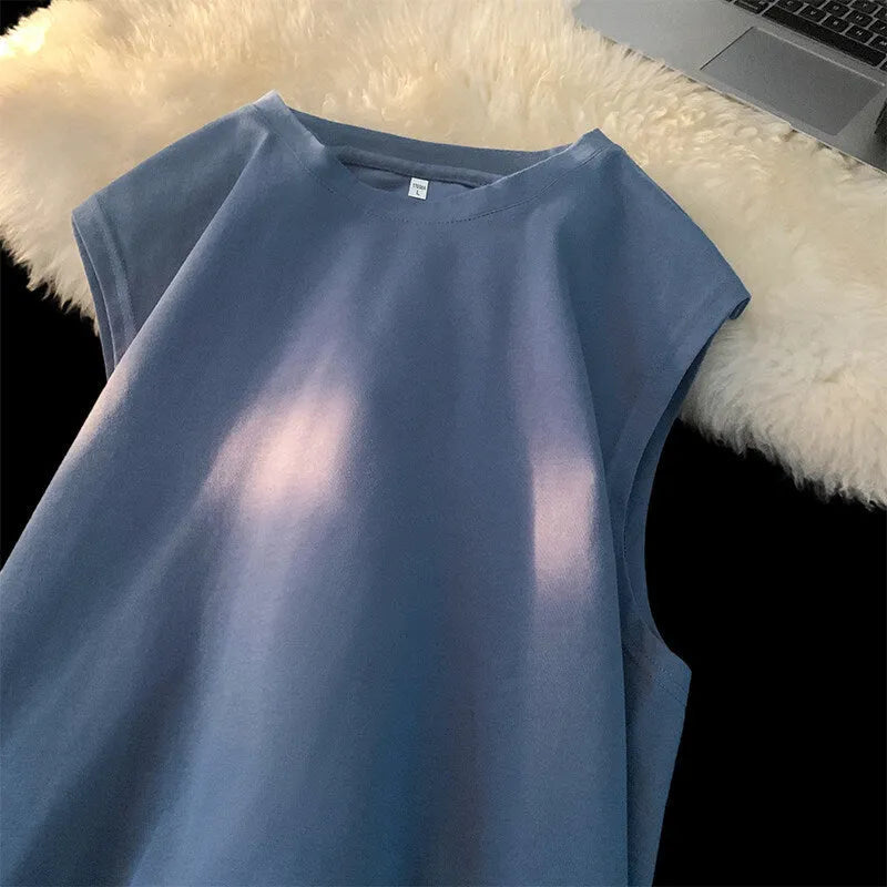 Men's loose solid colour cotton tank top sleeveless t-shirt on a hanger.