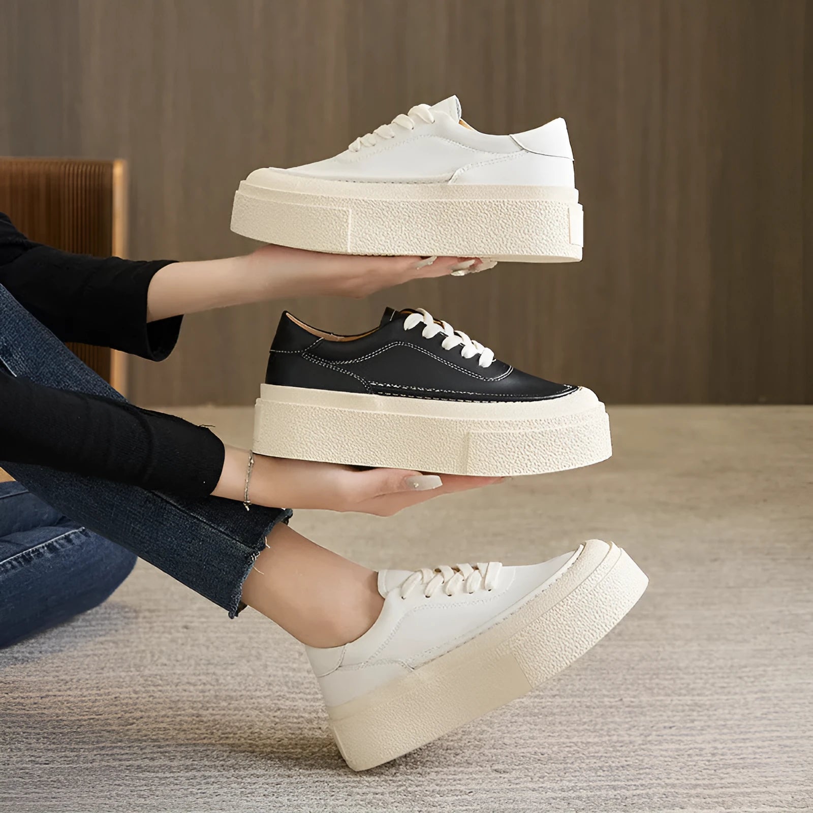 Women's black platform sports shoes with embossed cowhide upper and rubber sole, tied design detail
