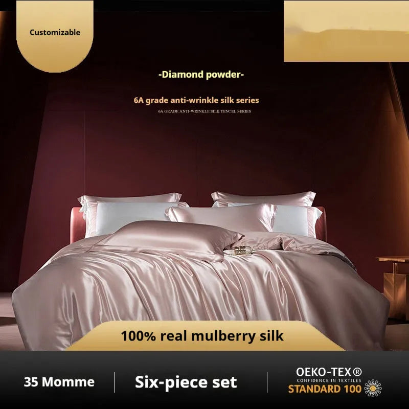 Silk four-piece quilt cover set in a solid colour, shown in a bedroom setting on a bed.