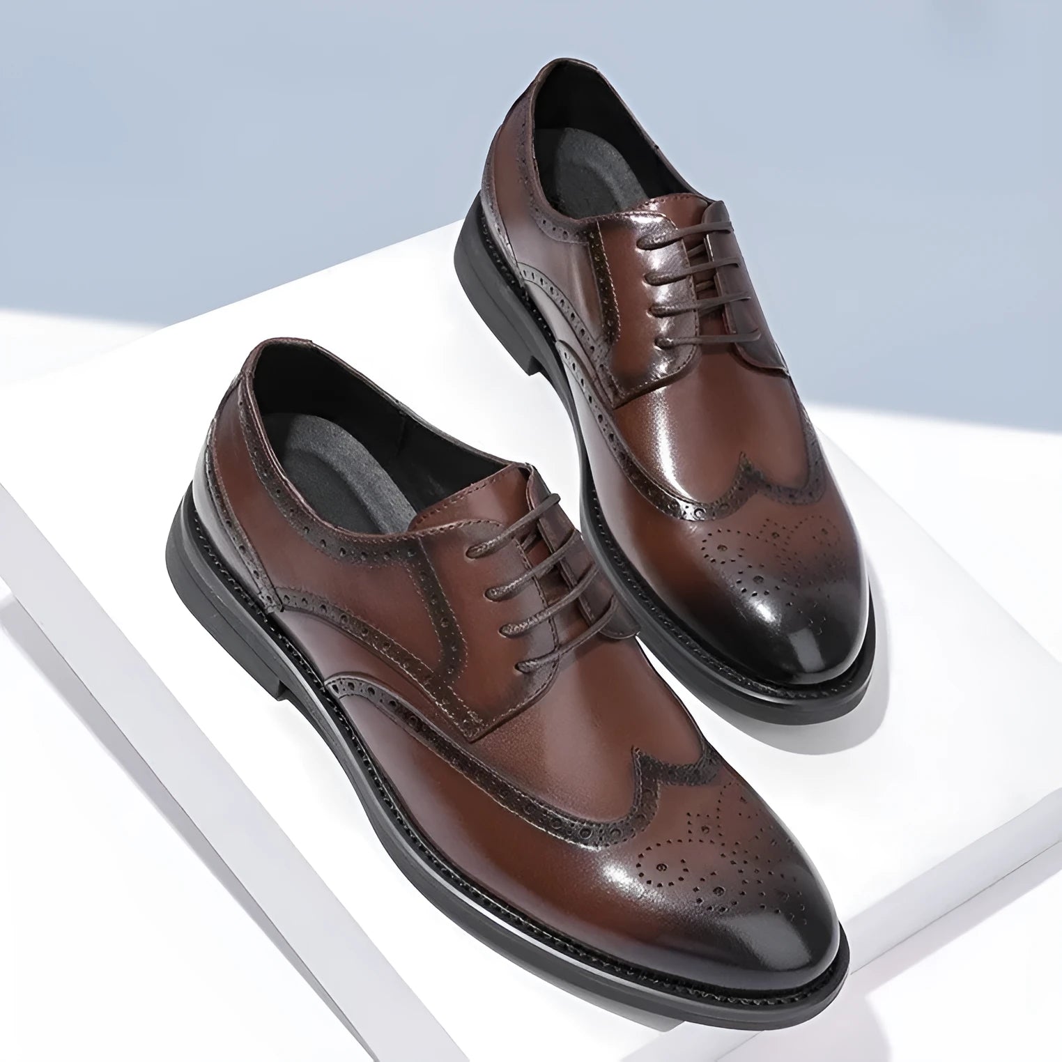 Men's black and brown brogue business shoes with classic perforated toe cap detailing