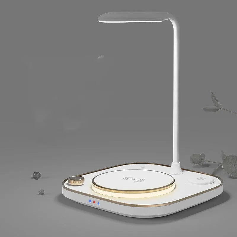 Black wireless charging desk lamp unit with smartphone charging on surface
