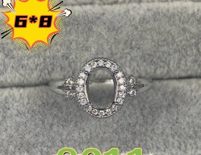Oval denier ring with five-pointed star ornamentation and 6x8 mm main stone