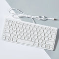 Mini wired USB computer keyboard in black, white, pink, or blue colour options.