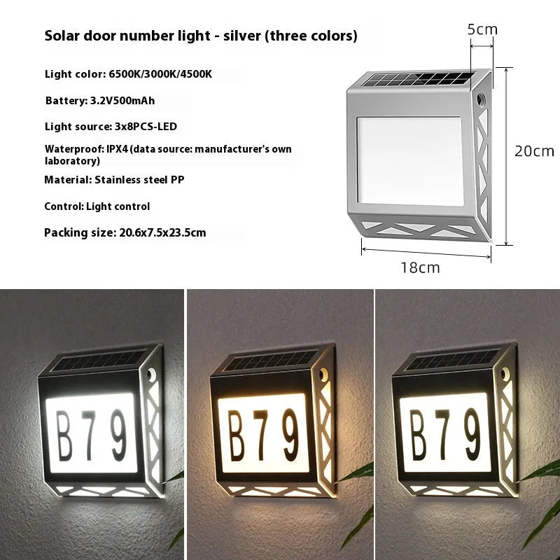 Black solar-powered doorplate light with LED illumination for house numbers measuring 180x50x200mm
